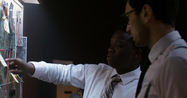 A diverse team of engineers collaborating in a brightly lit, modern office space, surrounded by whiteboards filled with diagrams and equations, illustrating the concept of collaborative innovation.