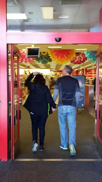 A crowded arcade in the 1980s, filled with people playing various arcade games like Pac-Man, Space Invaders, and Donkey Kong. The image should convey the vibrant atmosphere and excitement of the golden age of arcade gaming.