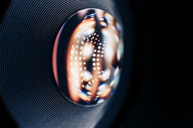 A close-up shot of a vinyl record spinning on a turntable, with a film reel visible in the blurred background, symbolizing the intersection of music and cinema.