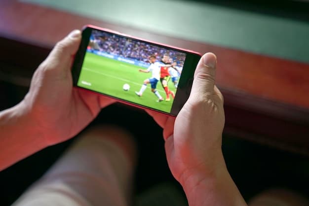 A close-up shot of a person's hands holding a smartphone displaying a live sports game. The interface showcases interactive elements like live chat, real-time statistics, and options for multiple camera angles, emphasizing the personalized and engaging experience offered by streaming services.