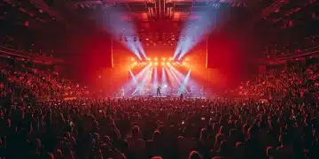 Electrifying concert performance with a massive crowd and dazzling stage lights.